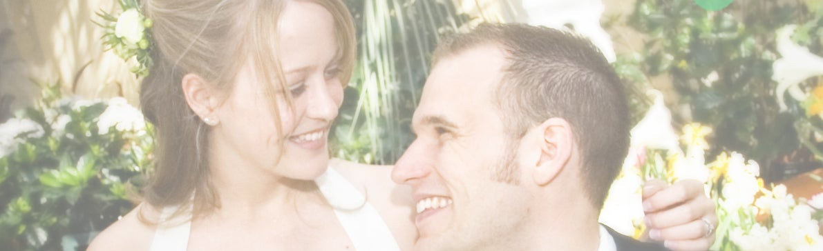 Couple smiling at each other with a blurred background