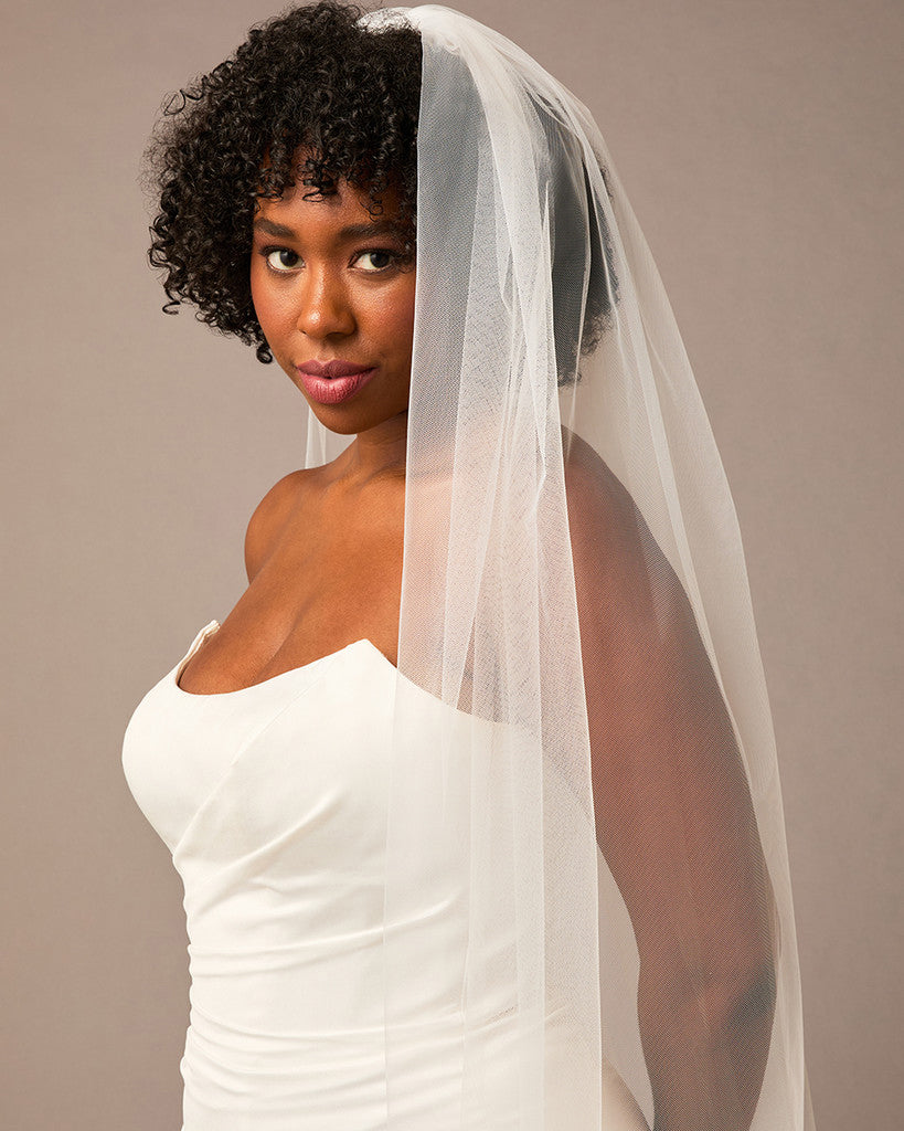 Woman wearing a white wedding dress and veil against a plain background 3D Flowers and Leaves Bridal Royal Cathedral Veil