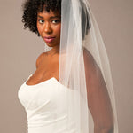 Woman wearing a white wedding dress and veil against a plain background 3D Flowers and Leaves Bridal Royal Cathedral Veil