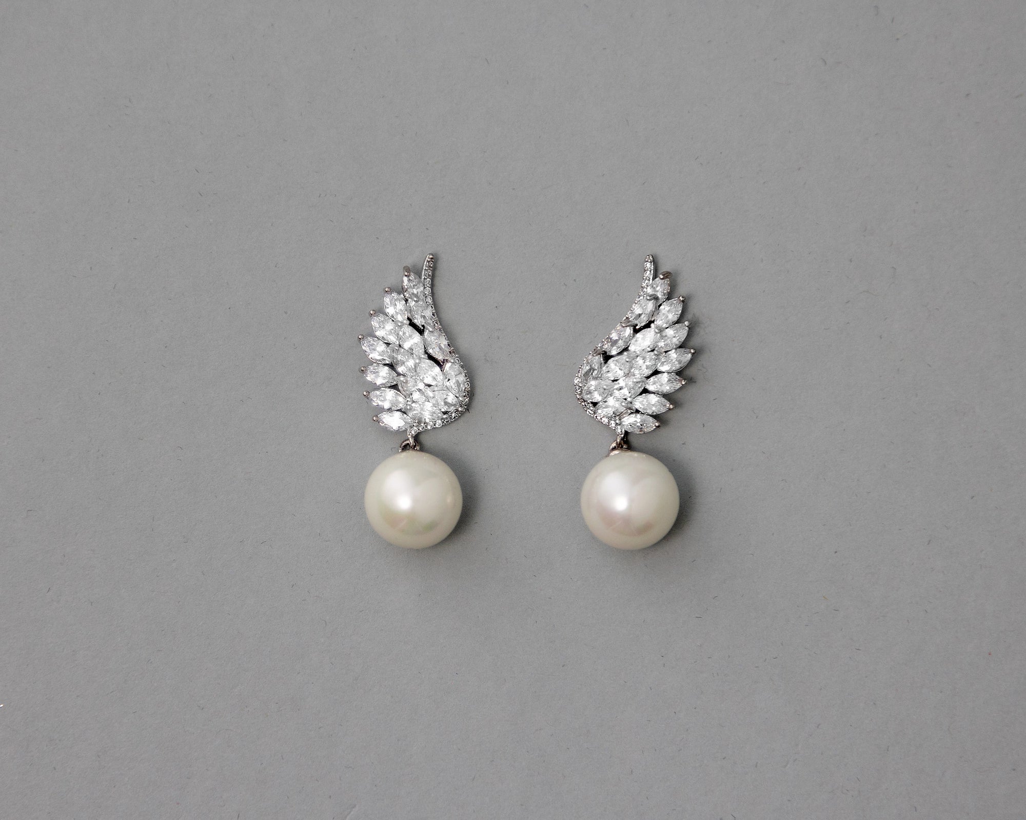 Ivory pearls and angle wings earrings