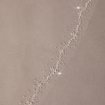 Pearl Wave Fingertip Bridal Veil Delicate floral trim on a beige background