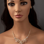 Three crystal covered starfish are surrounded by crystal stones and beads for a sparkly look. Matching bracelet here.