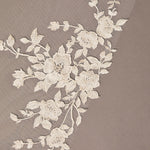 Cathedral Luxe Tulle Lace Wedding Veil Floral lace trim on a beige fabric background