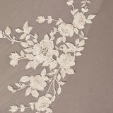Cathedral Luxe Tulle Lace Wedding Veil Floral lace trim on a beige fabric background