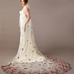Cathedral Wedding Veil with Burgundy and GReen Flower Lace Woman wearing a  wedding dress with floral details on a brown background