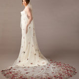 Cathedral Wedding Veil with Burgundy and GReen Flower Lace Woman wearing a  wedding dress with floral details on a brown background