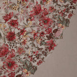 Cathedral Wedding Veil with Burgundy Flower Lace Close-up of intricate floral embroidery with red and gold flowers on a textured fabric background.