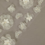 Ivory Cathedral Wedding Veil with 3D Organza Flowers Translucent floral overlay on a brown background
