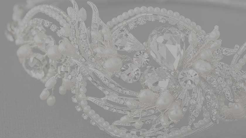 Decorative headband with intricate designs on a gray background