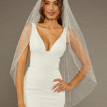 Fingertip Veil with Glitter and Sequins Woman wearing a wedding dress with a sheer veil against a neutral background