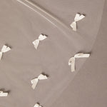 Royal Cathedral Veil of Luxe Tulle and Bows ivory ribbons arranged in a pattern