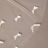 Royal Cathedral Veil of Luxe Tulle and Bows ivory ribbons arranged in a pattern