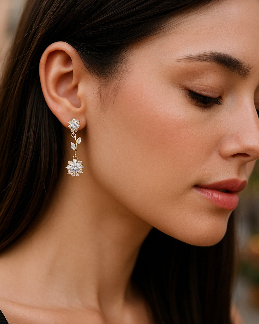 Close-up of a woman wearing a floral earring with a blurred background
