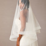 Two Inch Horsehair Trim Waltz Veil Bride wearing a veil against a plain background