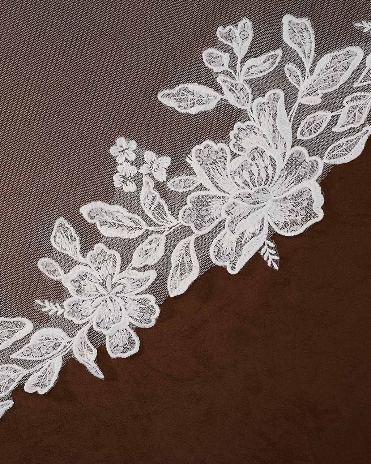 Cathedral Mantilla Wedding Veil Adorned with Lace Cassandra Lynne -floral lace trim with embroidered roses and leaves laid diagonally across a dark brown textured fabric background.