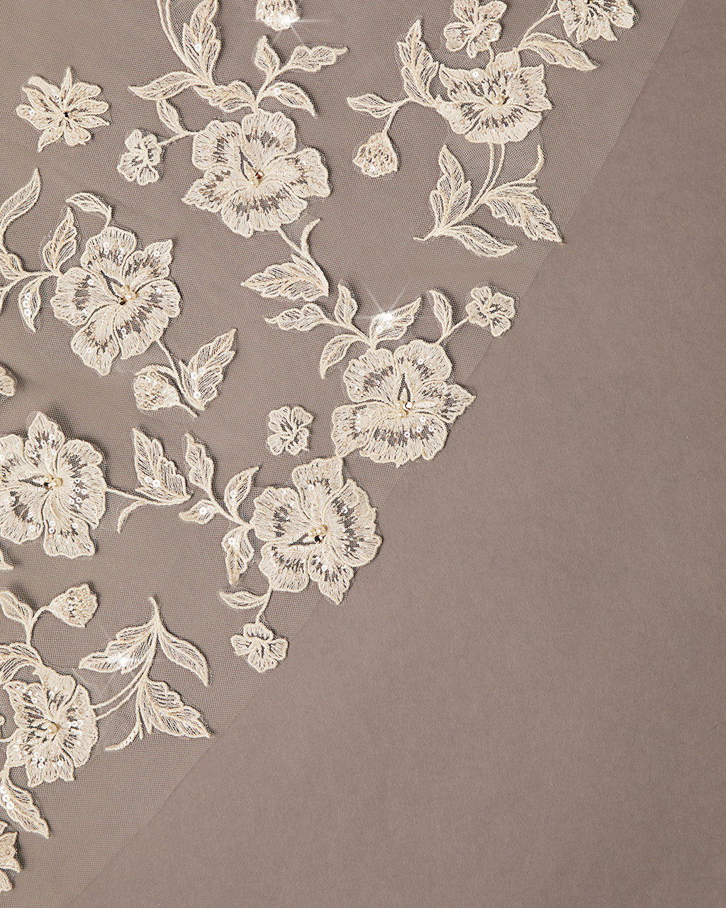 Lace Beaded Waltz Mantilla Wedding Veil Delicate floral lace pattern on a beige background