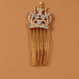 Regal Styled Small Wedding Hair Comb Gold-plated hair comb with clear rhinestones on a textured tan background.