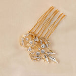  Dainty Regal Wedding Hair Comb gold hair comb decorated with clear rhinestones displayed on a beige fabric background.