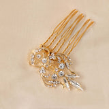  Dainty Regal Wedding Hair Comb gold hair comb decorated with clear rhinestones displayed on a beige fabric background.