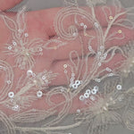 wedding veil with delicate sequined and beaded lace detail