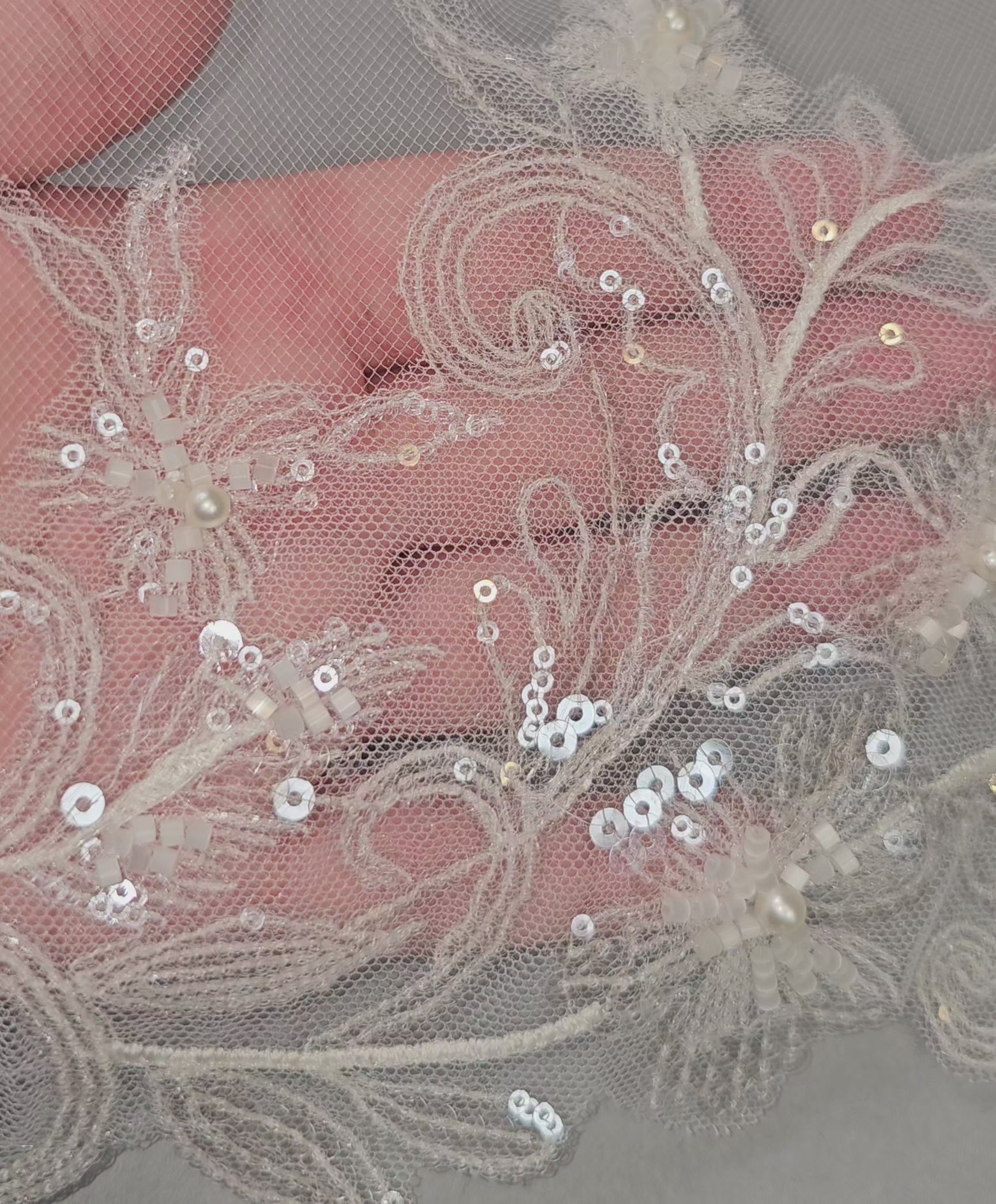wedding veil with delicate sequined and beaded lace detail