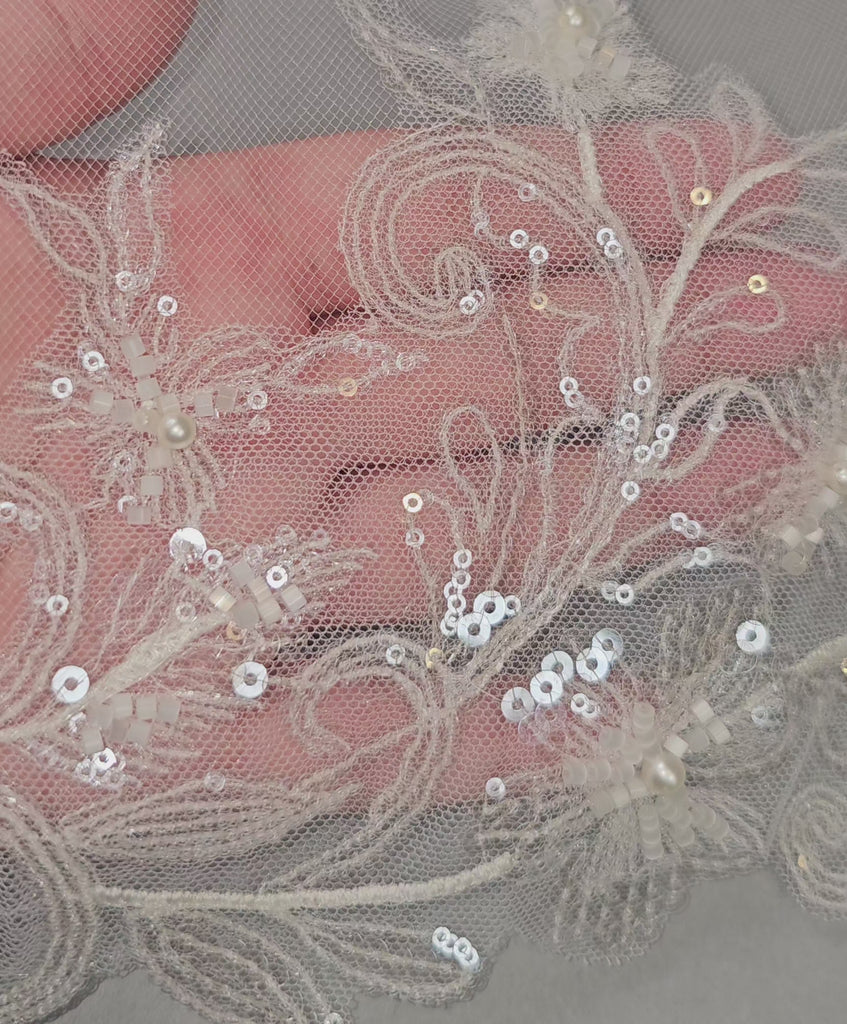 wedding veil with delicate sequined and beaded lace detail