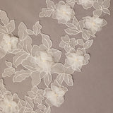 Close-up of floral lace on a beige background Partial Lace and Organza Flowers Cathedral Wedding Veil