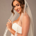 Partial Lace Trim Cathedral Bridal Veil Woman wearing a wedding dress with a veil against a neutral background