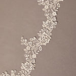 Partial Lace Trim Cathedral Bridal Veil Decorative floral lace on a brown background