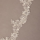 Partial Lace Trim Cathedral Bridal Veil Decorative floral lace on a brown background