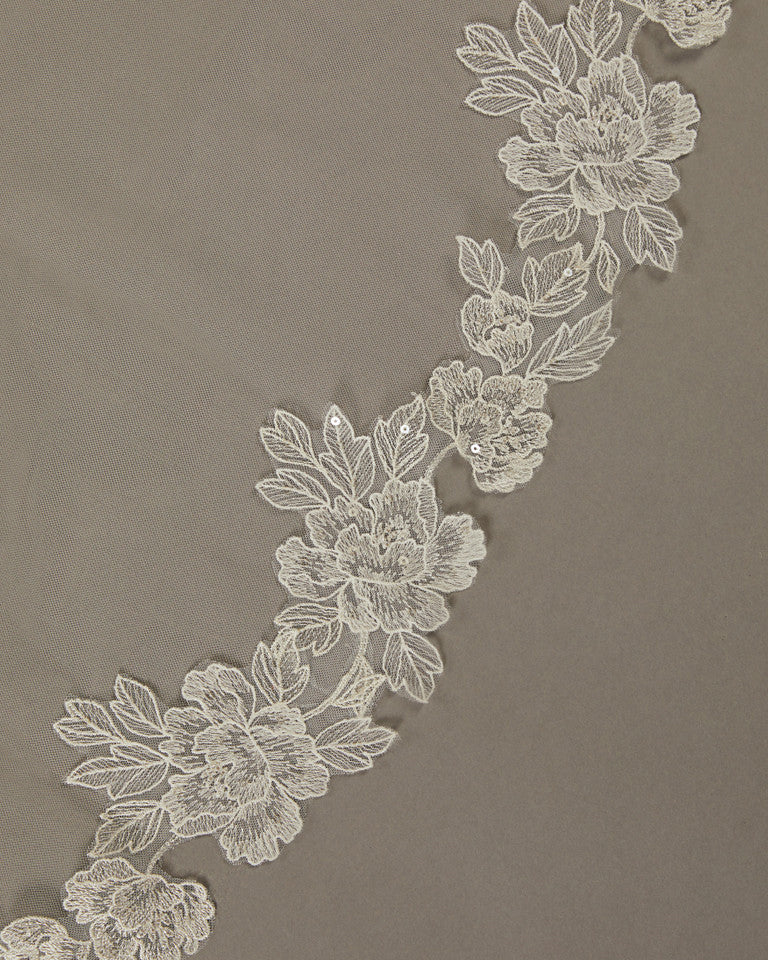 Sequined Lace Bridal Veil Royal Cathedral Length Decorative floral lace trim on a brown background