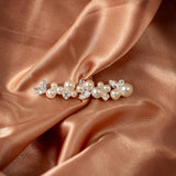 Bridal Bobby Pin with Ivory Pearls A pearl and crystal hair claw clip styled on draped champagne satin fabric.