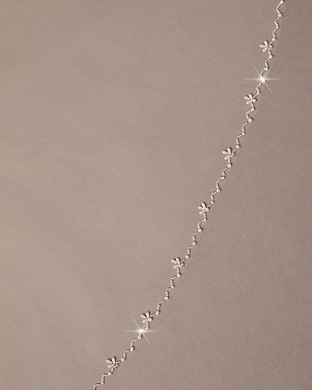 Zig Zag Teardrop Pearl Trimmed Bridal Veil floral designs on a beige background