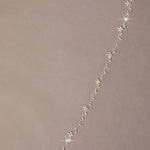 Zig Zag Teardrop Pearl Trimmed Bridal Veil floral designs on a beige background