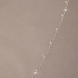Zig Zag Teardrop Pearl Trimmed Bridal Veil floral designs on a beige background