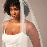 Zig Zag Teardrop Pearl Trimmed Cathedral Bridal Veil Woman wearing a wedding dress with a veil against a neutral background
