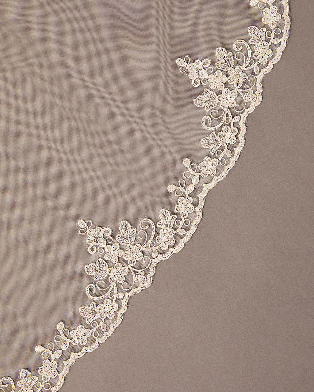  Waltz Wedding Veil with Alencon Lace Decorative lace trim on a brown background