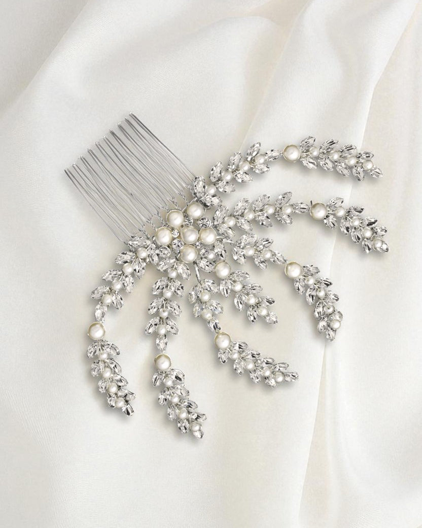 Silver hair comb with decorative elements on a white background Bridal Hair Comb with Ivory Pearls in Silver