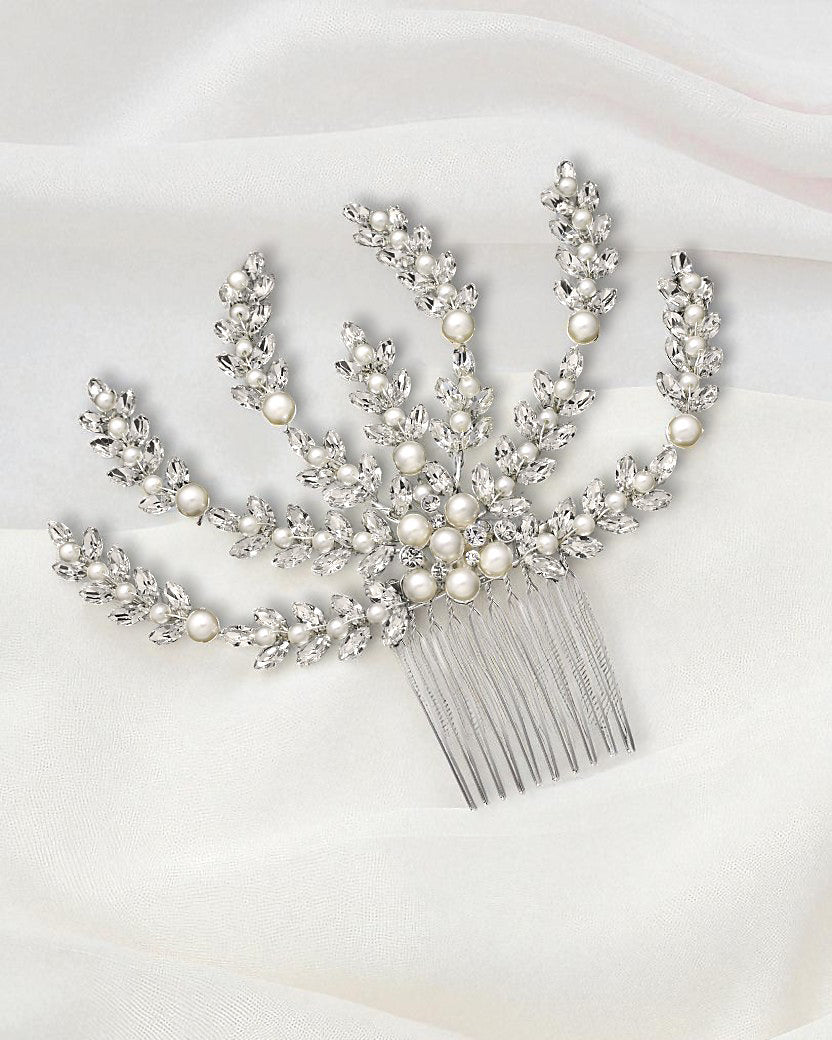 Decorative hair comb with pearls and crystals on a white background Bridal Hair Comb with Ivory Pearls in Silver