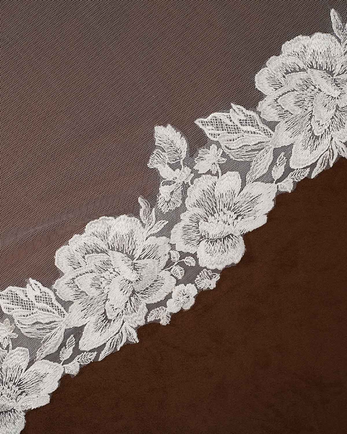 Wide Mantilla Cathedral Veil with Floral Lace Cassandra Lynne -floral lace trim with embroidered roses and leaves laid diagonally across a dark brown textured fabric background.