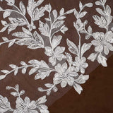 Cathedral Bridal Veil with Lace Flowers and Sequins Cassandra Lynne floral lace applique embroidered on sheer brown mesh fabric, showing detailed leaf and flower patterns.