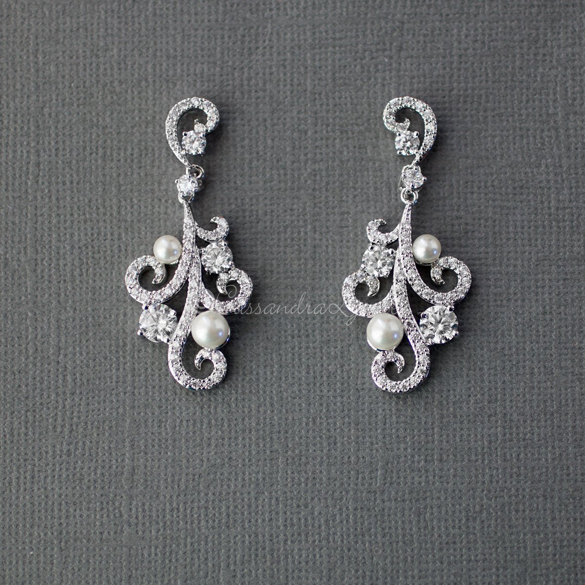 Clip On Pearl CZ Earrings with a Swirl Design